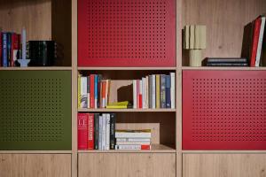 a book shelf with many books on it at Moxy Annecy in Annecy