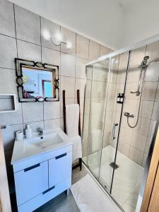 a bathroom with a sink and a shower at Quinta da Baldieira in Mondim de Basto