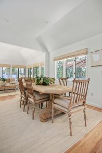 a dining room with a wooden table and chairs at 2908 Captain Sams in Seabrook Island