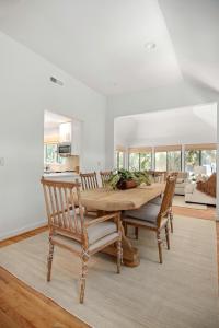 a dining room with a wooden table and chairs at 2908 Captain Sams in Seabrook Island +41 photos