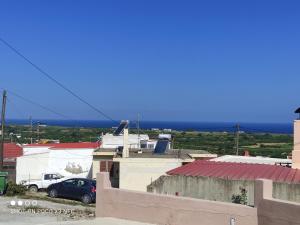 a view from the roof of a house with a car at michaelas traditional house in Fánai