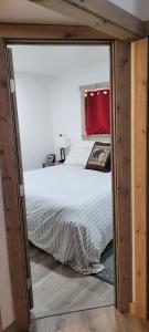 a bedroom with a large bed and a window at Greer Point Trails End Cabins in Greer