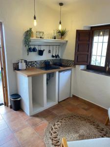 a kitchen with a counter and a counter top at Casita with Views of Frigiliana in Frigiliana