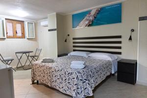 Postel nebo postele na pokoji v ubytování Guest House Albergabici La Cattedrale