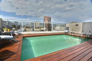 a swimming pool on the roof of a building at ARC Recoleta Boutique Hotel & Spa in Buenos Aires