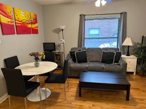 a living room with a couch and a table at Entire Apt in Heart of Chicago in Chicago