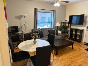 a living room with a couch and a table at Entire Apt in Heart of Chicago in Chicago