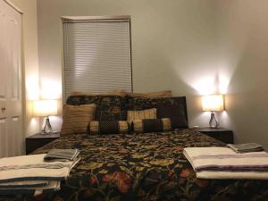 a bedroom with a large bed with two lamps at Entire Apt in Heart of Chicago in Chicago