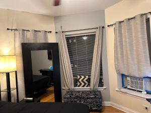 a living room with a couch and a window at Entire Apt in Heart of Chicago in Chicago