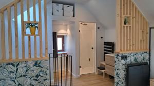 a staircase in a house with a stair case at Bulle en Ville Maisonnette de charme in Spa
