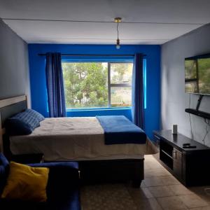 Letto o letti in una camera di Greggs Place at Capital Hill Arcadia