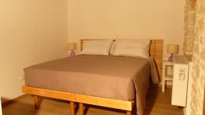Postel nebo postele na pokoji v ubytování To Portoni Guesthouse