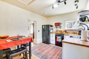 a kitchen with a sink and a refrigerator at Peaceful and Historic Home in Patagonia! in Patagonia +17 photos