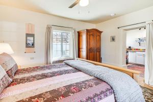 a bedroom with a bed and a window at Peaceful and Historic Home in Patagonia! in Patagonia