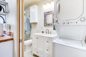 a white bathroom with a sink and a toilet at Peaceful and Historic Home in Patagonia! in Patagonia