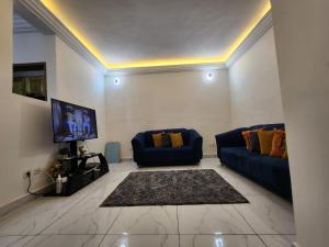 TV a/nebo společenská místnost v ubytování Cozy Bay