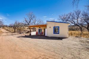 a small house in the middle of a dirt road at Peaceful and Historic Home in Patagonia! in Patagonia
