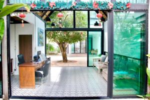 an office with a large aquarium and a desk at Chic Villa 6 in Chiang Mai