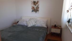 En eller flere senge i et værelse på Apartman Panorama A15 + 45 billeder