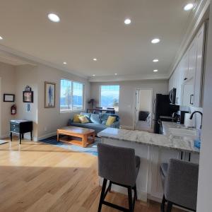 a kitchen and living room with a couch and a table at Rolling hills Ranch in Chelan +6 photos