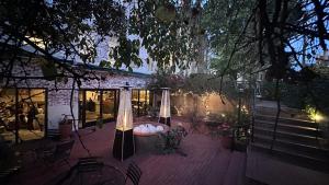 a patio with a table and chairs and a building at Ironclad Inn and Bourbon Room in Fredericksburg
