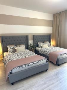 Posteľ alebo postele v izbe v ubytovaní Exclusive Apartments Smolna