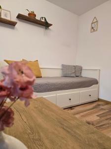 a bedroom with a bed in a room at KopiHome Liptov in Liptovský Hrádok