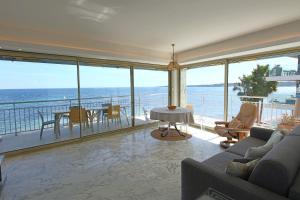 a living room with a view of the ocean at AMAZING SEA VIEW APARTMENT in Cannes