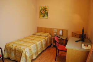Letto o letti in una camera di Hotel Tre Torri