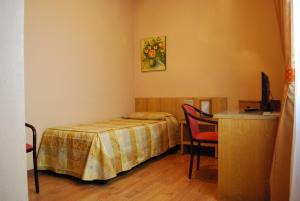 Letto o letti in una camera di Hotel Tre Torri