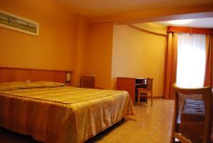 Letto o letti in una camera di Hotel Tre Torri