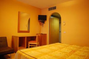 Letto o letti in una camera di Hotel Tre Torri