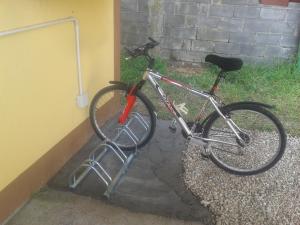a bike is parked next to a building at Casa Do Marabillas in Portomarin