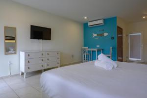 Ein Bett oder Betten in einem Zimmer der Unterkunft MERAKII SEAVIEW ESCAPE CURACAO