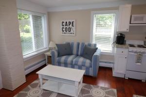 a living room with a couch and a table at Dennis Village Adorable Studio Cottage 5951 in Dennis
