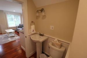 a bathroom with a toilet and a sink at Dennis Village Adorable Studio Cottage 5951 in Dennis