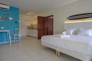 Ein Bett oder Betten in einem Zimmer der Unterkunft MERAKII SEAVIEW ESCAPE CURACAO