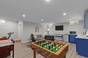 a living room with a foos ball in a table at 3325 Bright Urban Comfort in Tower Grove