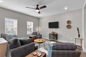 a living room with a couch and a table at 3325 Bright Urban Comfort in Tower Grove +44 photos