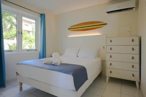 Ein Bett oder Betten in einem Zimmer der Unterkunft MERAKII SEAVIEW ESCAPE CURACAO