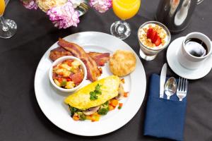 a plate of breakfast food with eggs bacon and toast at Kehoe House, Historic Inns of Savannah Collection in Savannah