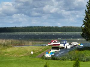 a group of boats are parked on a river at Karwik60 in Karwik