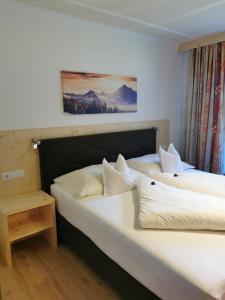 A bed or beds in a room at Appartement Gredler Martina