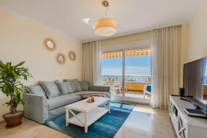 a living room with a couch and a tv at Hermitage Homes RPLA in Puerto de Santiago +50 photos