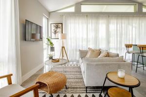 a living room with a couch and a table at Beautiful & Boho 2BR Villa 14 at Playa Venao in Playa Venao
