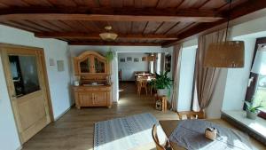 a living room with a table and a dining room at Gästehaus Kuchler in Lam