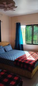 Postel nebo postele na pokoji v ubytování Hasmatullah Holiday Apartments