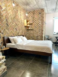Ένα ή περισσότερα κρεβάτια σε δωμάτιο στο Comfortable apartments with a coffee machine in the city centre, Zlata Plaza