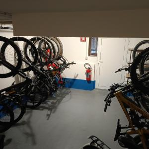 a group of bikes parked in a garage at Hotel Villa Chiara in Finale Ligure