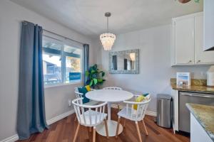 a kitchen with a white table and chairs at 3080 Lincoln - Unit 12 in Carlsbad